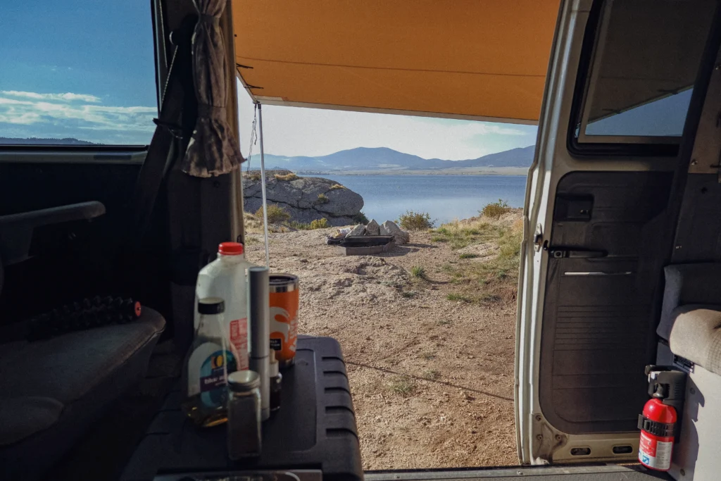 A shot from the interior or a VW Vanagon with the side-door open looking out to Eleven Mile SP Reservoir in Colorado